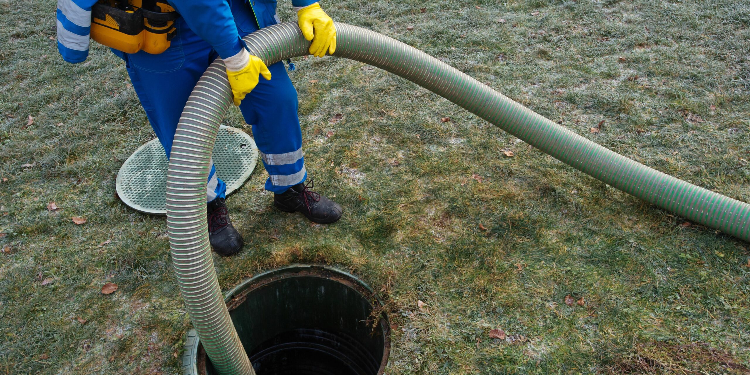 Man cleaning a water tank.