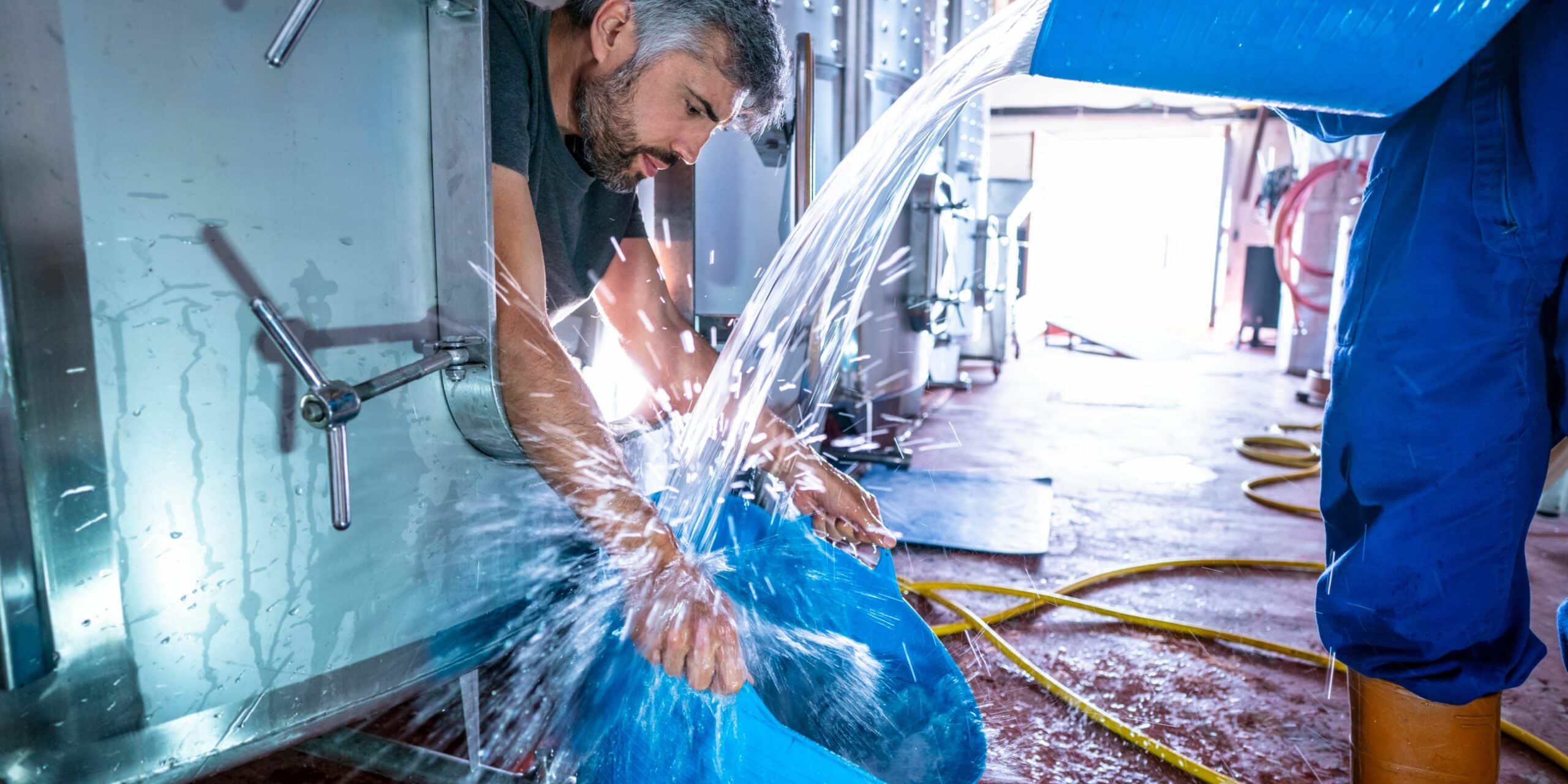 Man cleaning a water tank